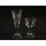 A 19th Century continental green coloured drinking glass and two 18th Century clear drinking