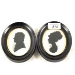 Two signed oval silhouettes of a lady and a gentleman