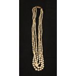 A triple strand Pearl necklace with foliate,