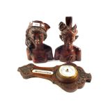 A pair of Balinese hardwood busts and a carved Oak barometer