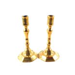 A pair of Queen Anne Brass candlesticks,