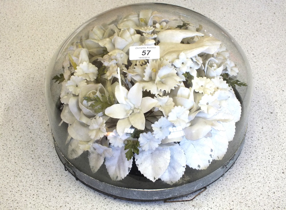 A Victorian paper floral memorial with white porcelain dove under squat glass dome, height 7",