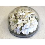 A Victorian paper floral memorial with white porcelain dove under squat glass dome, height 7",