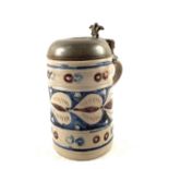 An 18th Century German Westerwald stoneware cylindrical tankard with incised foliate decoration,