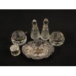 Two cut glass Silver rimmed scent bottles (both necks as found), two Silver salts,