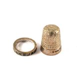 A Silver ring together with a Silver thimble