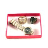 A Gold inlaid horn heart,