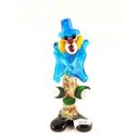 A Murano glass clown with blue hat and coat