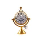 A Brass cased table top ball clock
