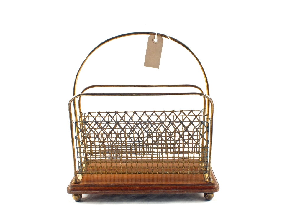 A late Victorian Oak and Brass two division magazine rack