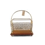 A late Victorian Oak and Brass two division magazine rack