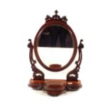 A Victorian carved Mahogany swing toilet mirror