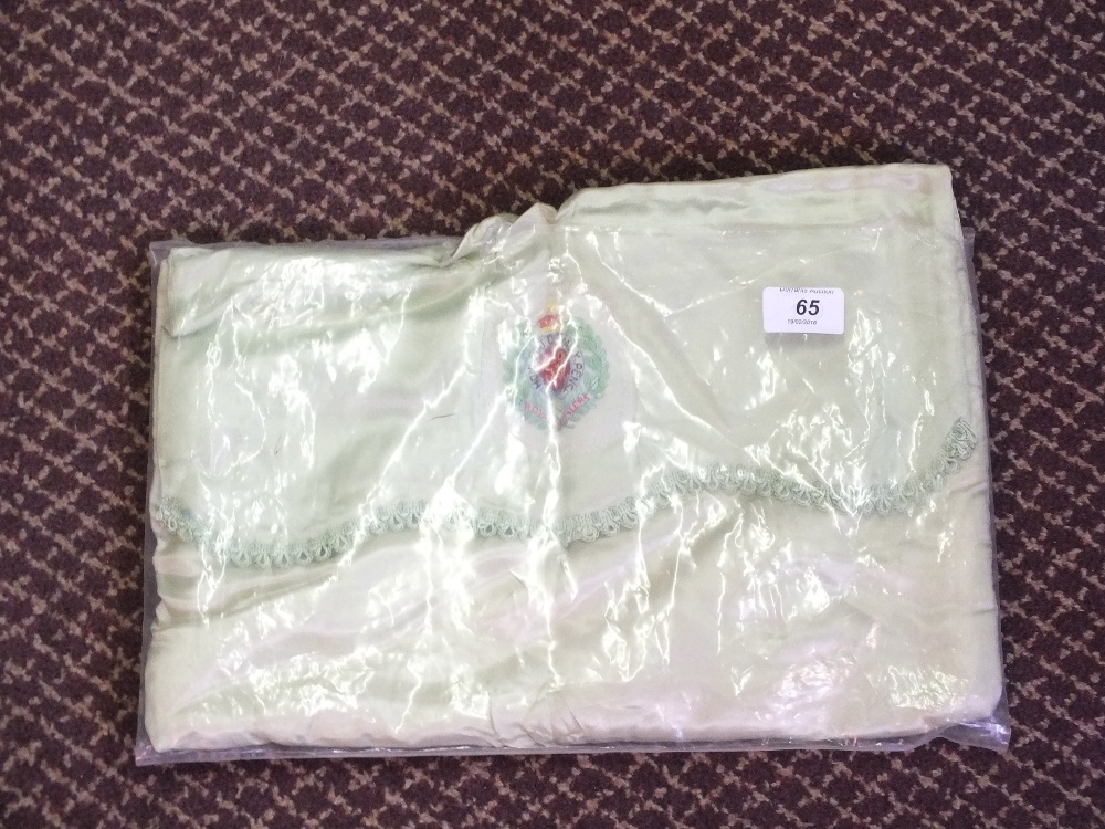 A green silk bag with G.R.