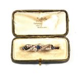 A Gold Diamond and Sapphire set brooch, estimated total Diamond weight 1.