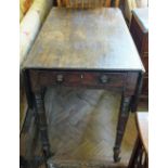 A Victorian Mahogany Pembroke table on turned legs