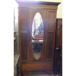 An Edwardian inlaid Mahogany single mirror door wardrobe