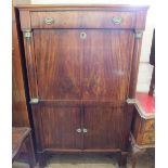 A Regency Mahogany secretaire with a single drawer over fall front fitted interior flanked with