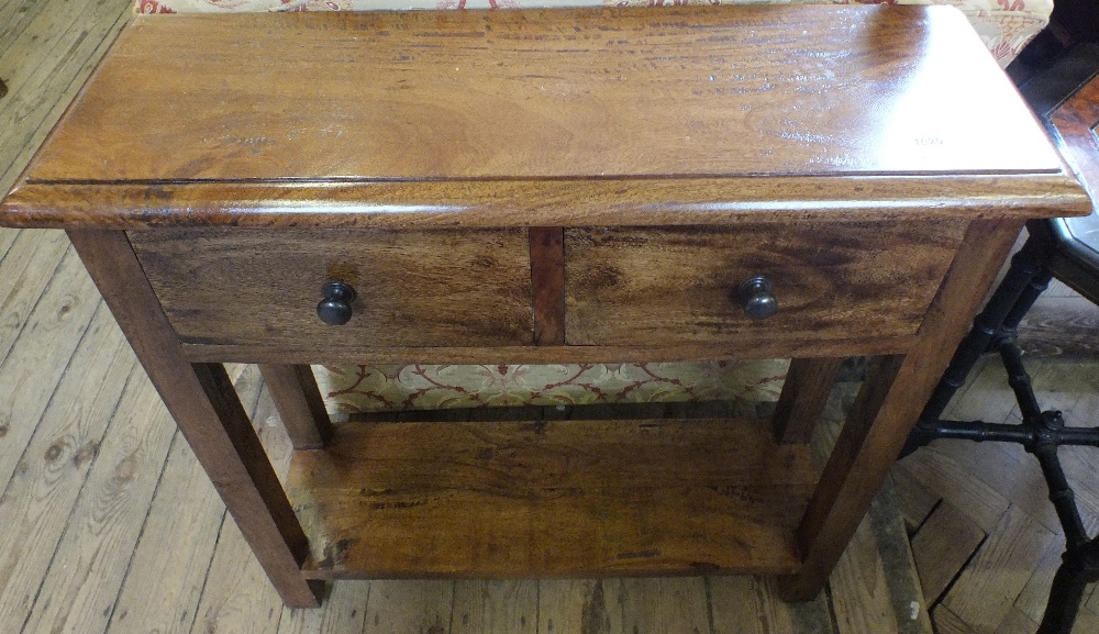 A hardwood two drawer hall table