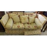 A red and cream upholstered Knole settee with upholstered foot stool