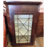 A 19th Century astral glazed hanging corner cupboard with four shelves