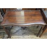 A 19th Century Mahogany shaped side table with carved gallery and under tier (some damage to