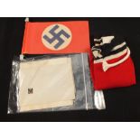 A German WWII (PATTERN) flag with paper patriotic Nazi flag and two German Red Cross letters