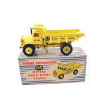 A boxed Dinky 965 Euclid dump truck with yellow body, no windows,