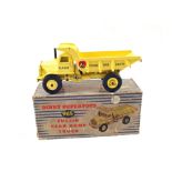 A boxed Dinky 965 Euclid dump truck with yellow body, no windows,