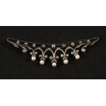 A large Silver and Gold set brooch set with Diamonds and Pearls,