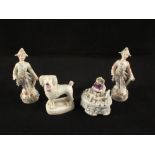 A 19th Century Staffordshire miniature porcelain dog and three continental figurines