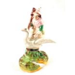 A Victorian Staffordshire figurine of a witch astride a goose,