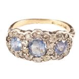 An 18ct Gold three stone Sapphire and Diamond cluster ring, Sapphire weight est 2.