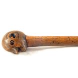 A South African tribal stick with head finial,