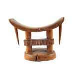 A South African tribal headrest of rare form, length 9",