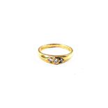 An 18ct Gold ring set with three Diamonds,