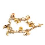 A 9ct Gold multi link bracelet with 9ct Gold charms