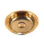 An 18th Century Brass or bell metal bowl with raised central boss,