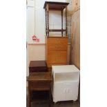 Various filing cabinets, a white cupboard,