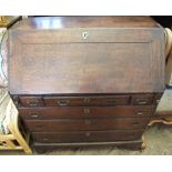 A Georgian Mahogany bureau with three short drawers over three graduated drawers on bracket feet