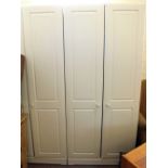 A pair of white modern two door wardrobes