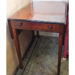 A 19th Century Mahogany Pembroke table on square tapered legs