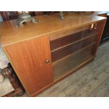 A 1960's Teak sideboard and a glazed bookcase