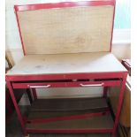 A painted metal single drawer work bench