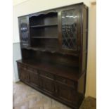 A reproduction Mahogany dresser with two lead glazed doors over four drawers and four doors