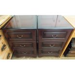 A pair of reproduction Mahogany three drawer bedside chests