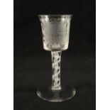 A Georgian wine glass with bucket shaped bowl on plain stem with opaque gauze centre surrounded by