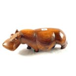 A carved wooden model of a Hippo,