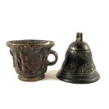 An antique Bronze mortar with loop handle and raised buttresses and figures,