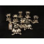 A pair of continental Silver plated three branch candlesticks