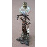 A spelter lady table lamp with painted glass bowl